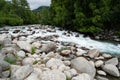 Little Susitna River creek flows through the large rocks and stones in Alaska